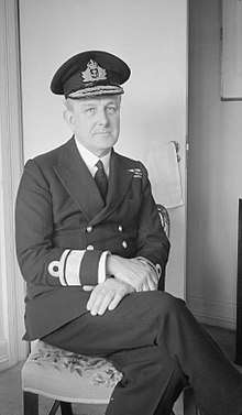 Photograph of Godfrey, seated in his uniform