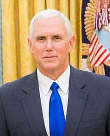 Mike Pence, in a suit and royal-blue tie