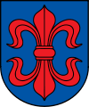 A coat of arms depicting a large, red fleur-de-lis that has a horizontal symmetry axis all on a blue background bordered by a black line