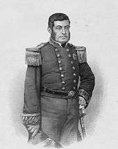 Engraved three-quarters portrait of a dark-haired man standing, dressed in a double-breasted, embroidered military tunic with his left hand on the pommel of his sheathed sword and his right hand holding a bicorn hat