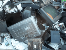 Waste electrical items accumulate at a dump.