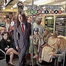A man is standing in the middle of a subway car, wearing a suit. He is surrounded by seemingly normal people (e.g. commuters); however, the man has a poodle sitting atop his head.