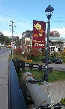 Welcome to Hardwick banner over Lamoille River.