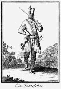 Black and white full-length drawing of a Janissary musketeer with a long moustache.