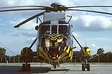 A Westland Sea King HAS6 of 814 NAS in a tiger colour-scheme, representing the unit's status as a member of the NATO Tiger Association.