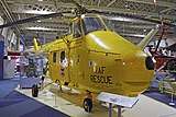 A yellow painted helicopter