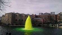 A fountain with green water