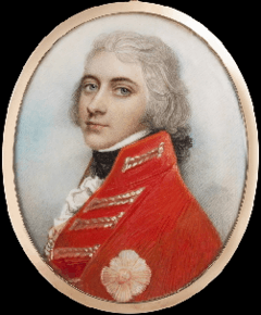 Miniature oval portrait on ivory of a youthful-looking man who nevertheless has white hair. He wears a scarlet military coat.