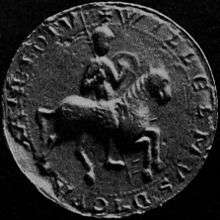 Black and white photograph of a mediaeval seal depicting a mounted knight.