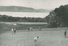 Golfers on a large riverside course