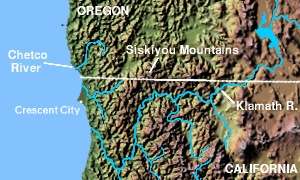 A map showing the terrain of the Chetco River region. The Pacific Ocean is located to the west, Oregon to the north, and California to the south. The Chetco River is located north of the larger Klamath River and the town of Crescent City, and west of the Siskiyou Mountains.