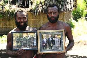 Yaohnanen Tribesmen with photos of Prince Philip