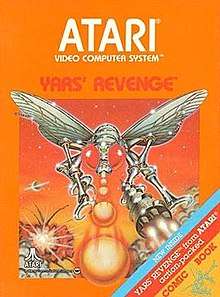 Artwork of a orange, vertical rectangular box. The top half reads "Atari Video Computer System" and below "Yars' Revenge". The bottom half displays a drawn image of a silver robotic fly in battle. On the bottom-right corner there is a tricolor ribbon that says, "New inside. Yars' Revenge from Atari action-packed comic book".