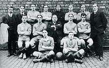 Players and staff posing for a photograph