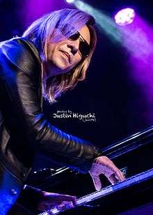 Yoshiki performing the piano while attending a Q&A session in SanFancisco promoting the film We Are X.