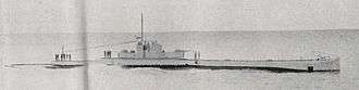a black and white image of a submarine underway on the surface