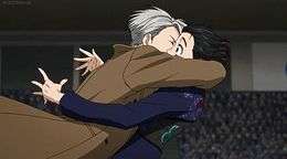 A screenshot from the show, depicting Victor apparently kissing Yuri K., who looks surprised