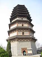 A wide, octagonal pagoda. It has four tall, functional floors made of brick, and an additional five, short, purely decorative floors made of wood. Each floor is separated by an eave, and the top five floor's eaves look as if they were simply stacked right on top of one another.