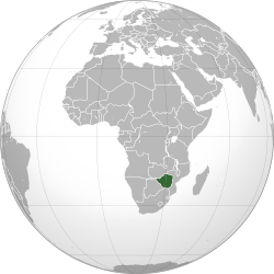 An orthographic projection of the world, centred on the Congo. Political borders are marked. Rhodesia (modern Zimbabwe) is highlighted in green.