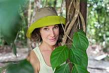 woman in pith helmet with vine