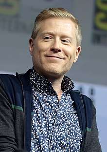 Anthony Rapp smiling and looking slightly to the side.